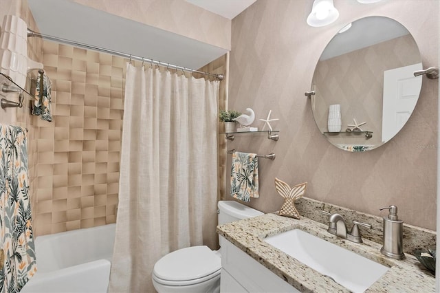 full bathroom featuring vanity, shower / bathtub combination with curtain, and toilet