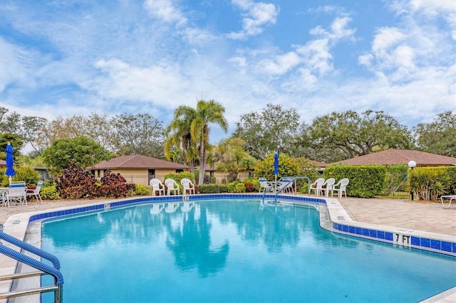 view of pool featuring a patio area