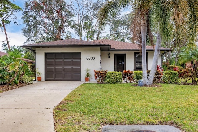 view of front facade featuring a garage and a front yard