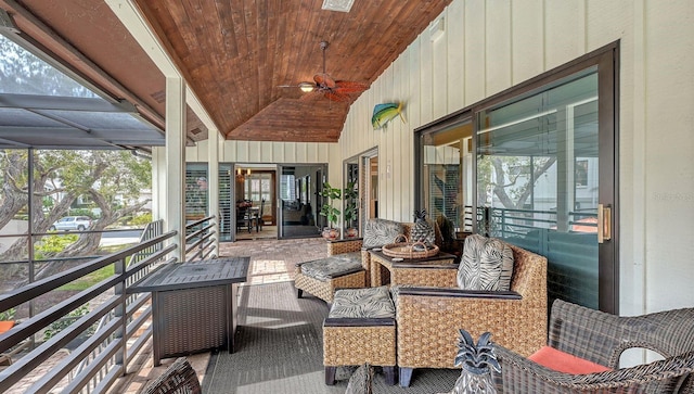 sunroom / solarium featuring ceiling fan, lofted ceiling, and wood ceiling