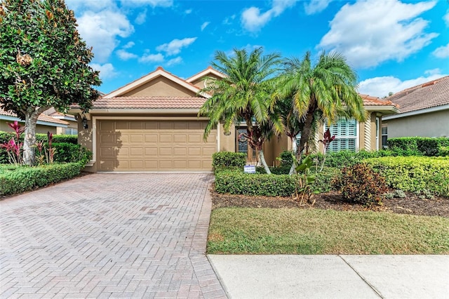 view of front of property with a garage