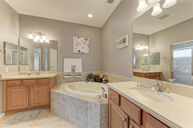 bathroom with vanity, tile patterned floors, and separate shower and tub