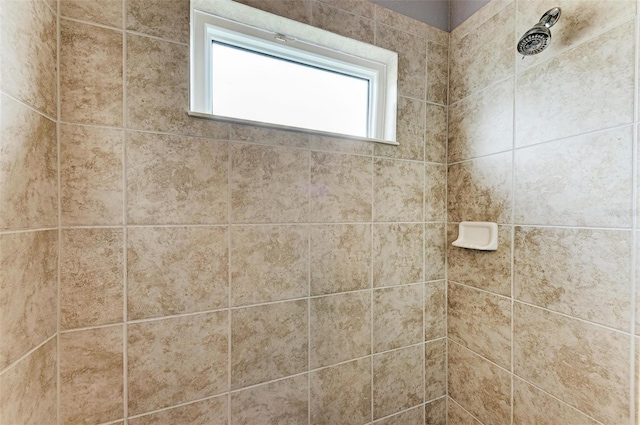 bathroom with a tile shower