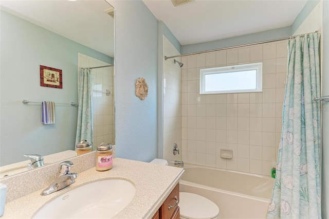 full bathroom with vanity, toilet, and shower / bath combo with shower curtain