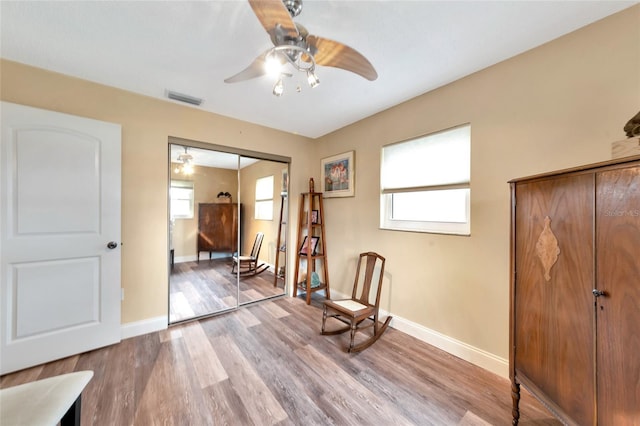 unfurnished room featuring light hardwood / wood-style floors and ceiling fan