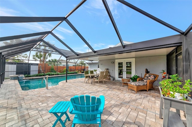 view of swimming pool featuring glass enclosure, a patio, french doors, and outdoor lounge area