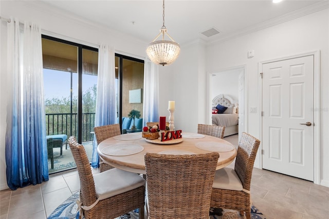 tiled dining space with crown molding and a chandelier