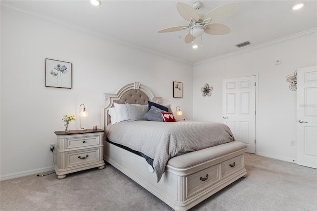 carpeted bedroom with ceiling fan and crown molding