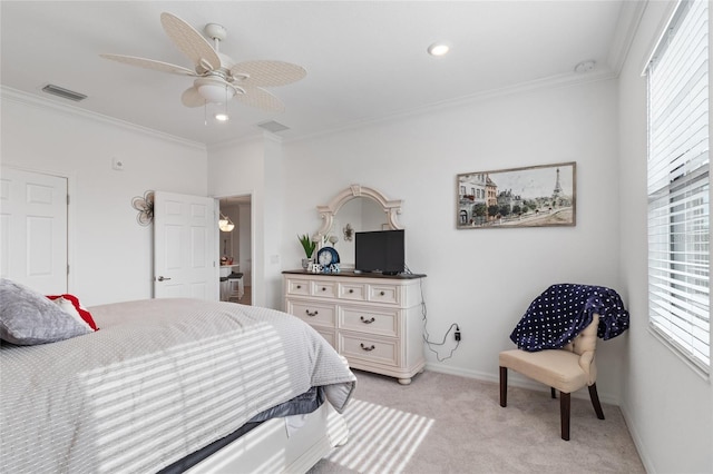 bedroom with ceiling fan, ornamental molding, and light carpet