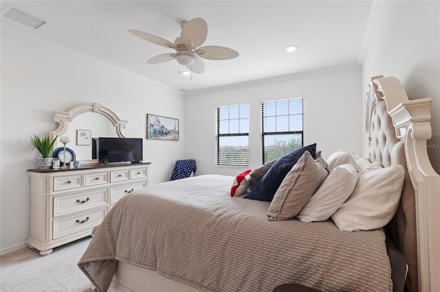 bedroom with ceiling fan, light colored carpet, and crown molding