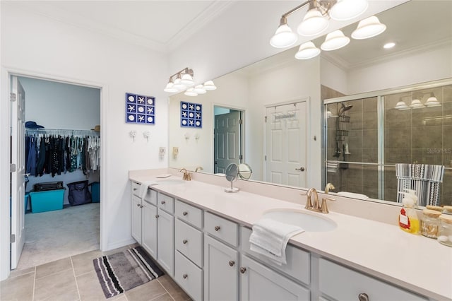 bathroom featuring a shower with shower door, a chandelier, tile patterned floors, ornamental molding, and vanity