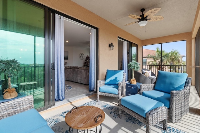 sunroom with ceiling fan and a healthy amount of sunlight