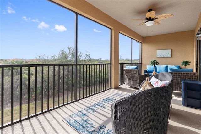 sunroom with ceiling fan and a wealth of natural light