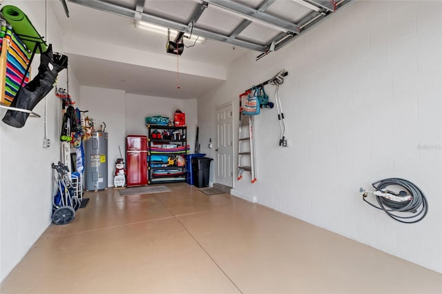 garage featuring electric water heater and a garage door opener