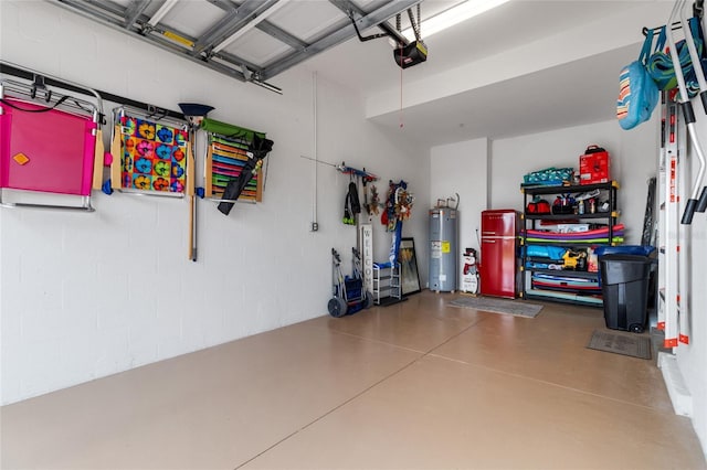 garage with water heater and a garage door opener