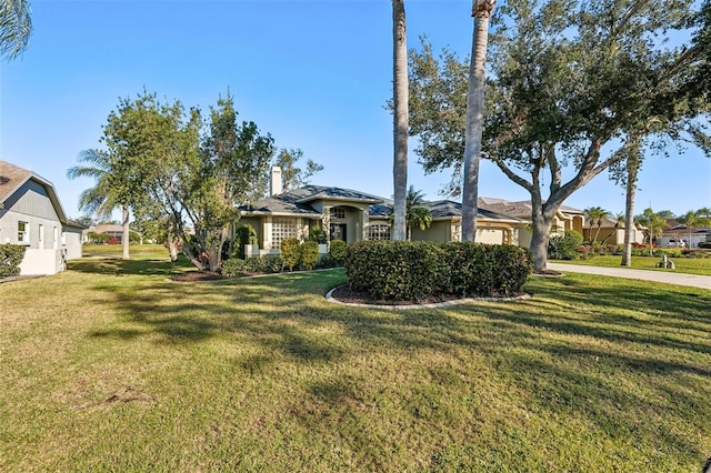 single story home featuring a front yard