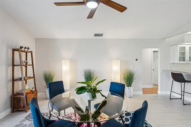 dining room featuring vaulted ceiling and ceiling fan