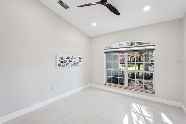 empty room featuring vaulted ceiling and ceiling fan