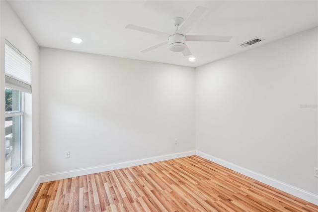 empty room featuring ceiling fan and light wood-type flooring