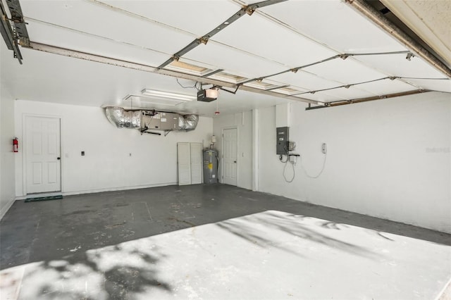 garage with a garage door opener, electric panel, and water heater