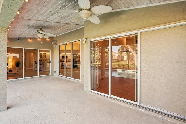 interior space with lofted ceiling, wooden ceiling, and ceiling fan