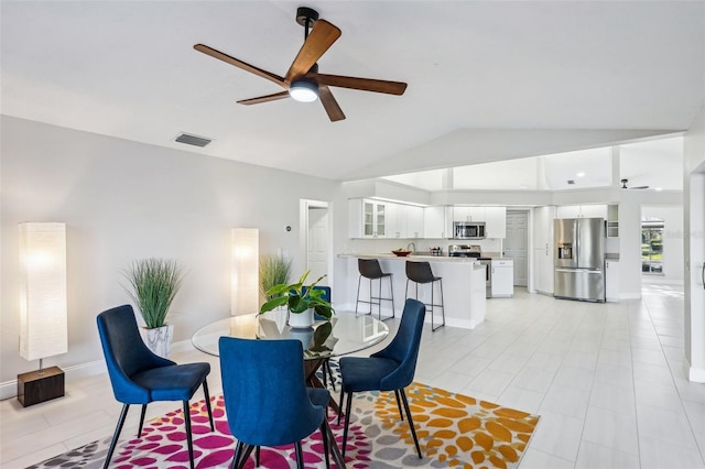 dining room featuring vaulted ceiling and ceiling fan