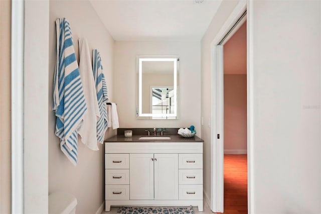 bathroom with vanity and hardwood / wood-style flooring