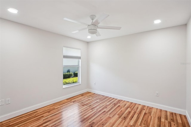 unfurnished room with ceiling fan and light wood-type flooring