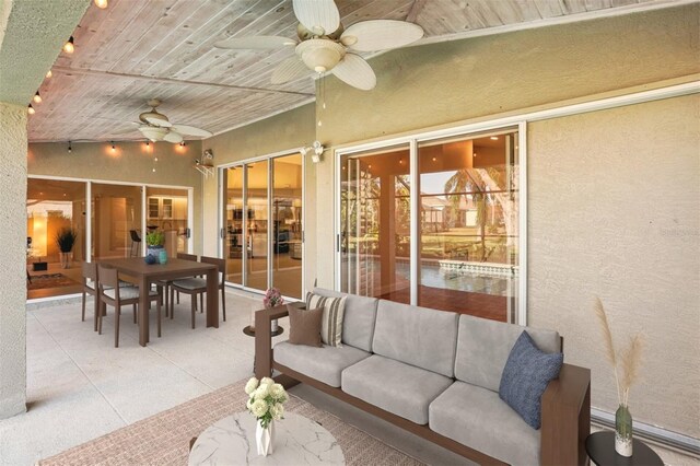 interior space featuring wood ceiling, ceiling fan, and vaulted ceiling