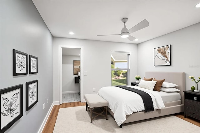 bedroom featuring baseboards, recessed lighting, wood finished floors, and ceiling fan