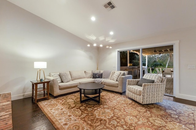 living room with hardwood / wood-style flooring and lofted ceiling