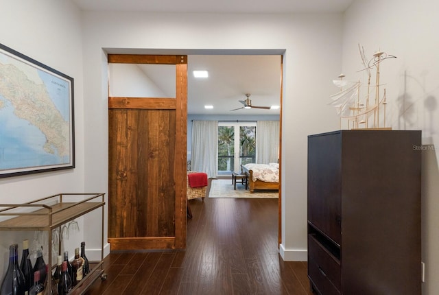 hallway with dark hardwood / wood-style floors