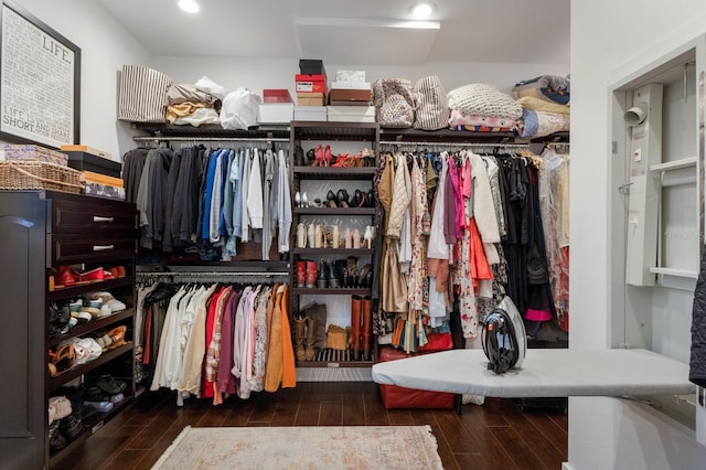 walk in closet with dark hardwood / wood-style flooring