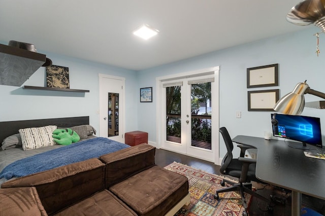 bedroom with hardwood / wood-style flooring, access to exterior, and french doors