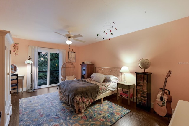 bedroom featuring ceiling fan, dark wood-type flooring, and access to outside