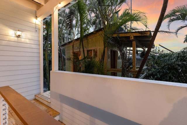 view of balcony at dusk