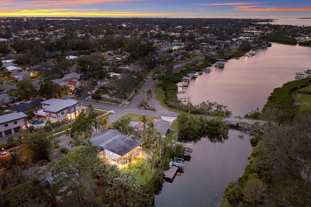 aerial view at dusk with a water view