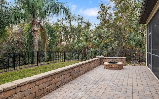 view of patio featuring an outdoor fire pit