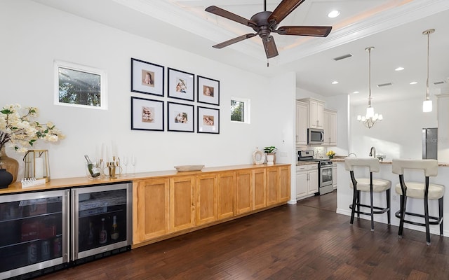 bar featuring backsplash, pendant lighting, dark wood-type flooring, stainless steel appliances, and beverage cooler