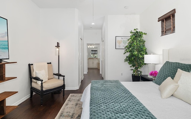 bedroom with dark wood-type flooring