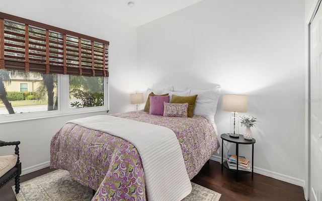 bedroom featuring dark wood-type flooring