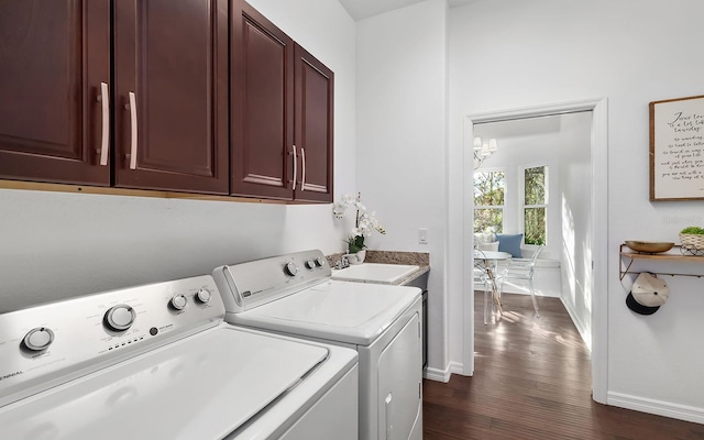 washroom with washer and dryer, dark hardwood / wood-style flooring, cabinets, a chandelier, and sink