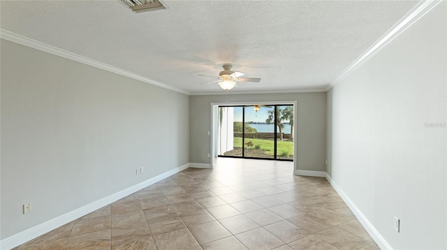 spare room with light tile patterned flooring, ceiling fan, ornamental molding, and a textured ceiling