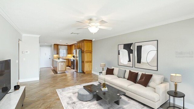 living room with light tile patterned floors, crown molding, and ceiling fan