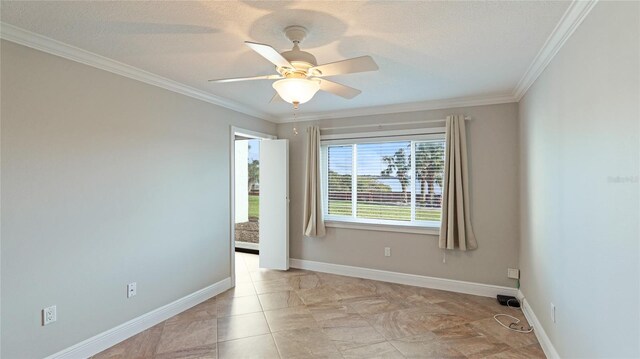 empty room with crown molding, ceiling fan, and light tile patterned floors