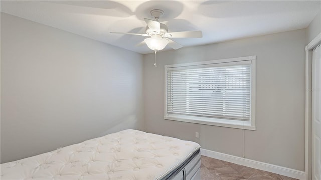 bedroom featuring ceiling fan