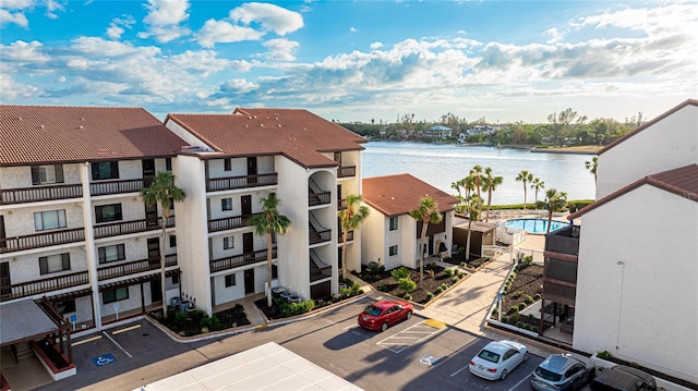 birds eye view of property featuring a water view