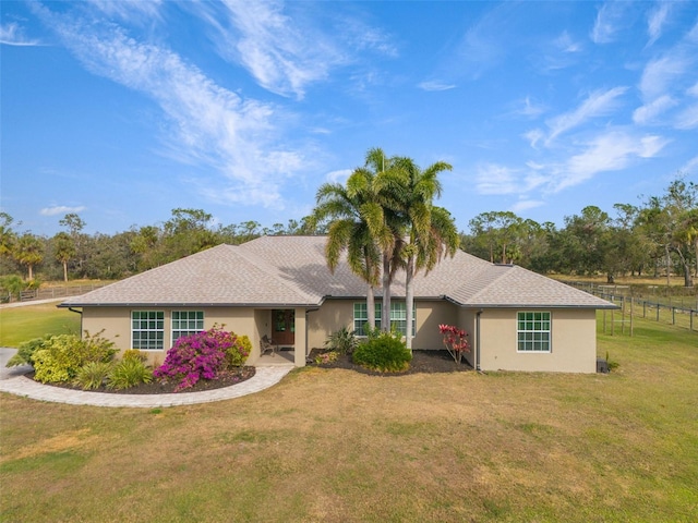 ranch-style home with a front yard