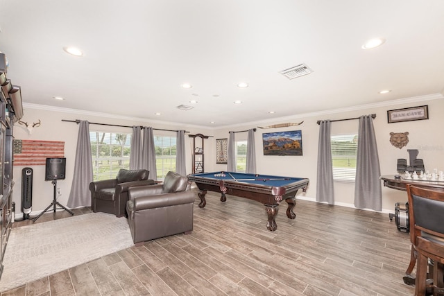 recreation room with a wealth of natural light, light hardwood / wood-style flooring, and crown molding