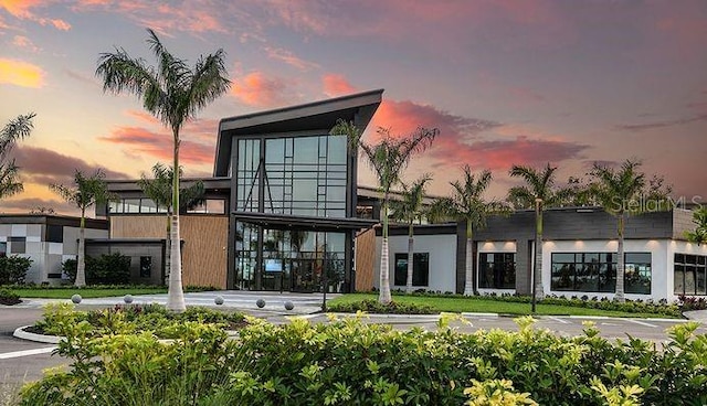 view of outdoor building at dusk